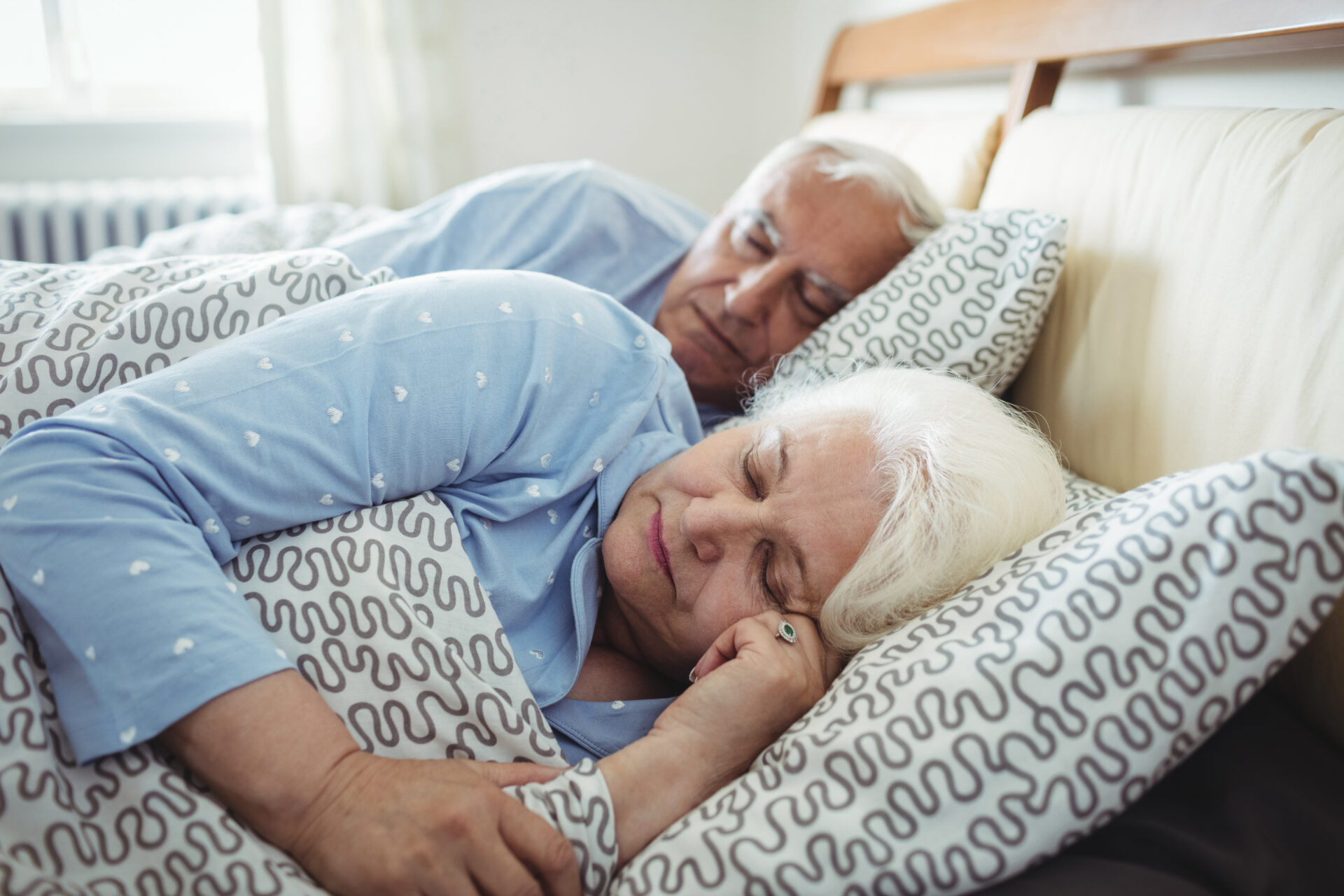senior couple sleeping on bed 2021 08 28 17 21 05 utc