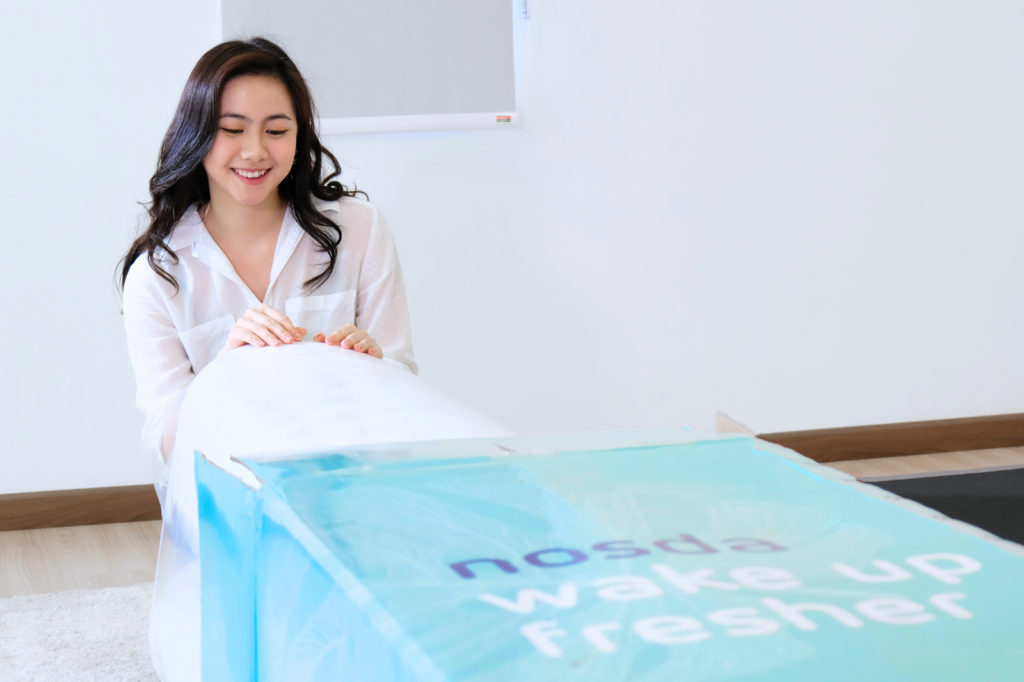 Woman unboxing Nosda Mattress