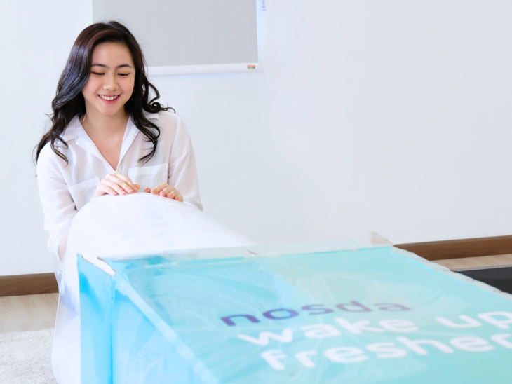 Woman unboxing Nosda Mattress